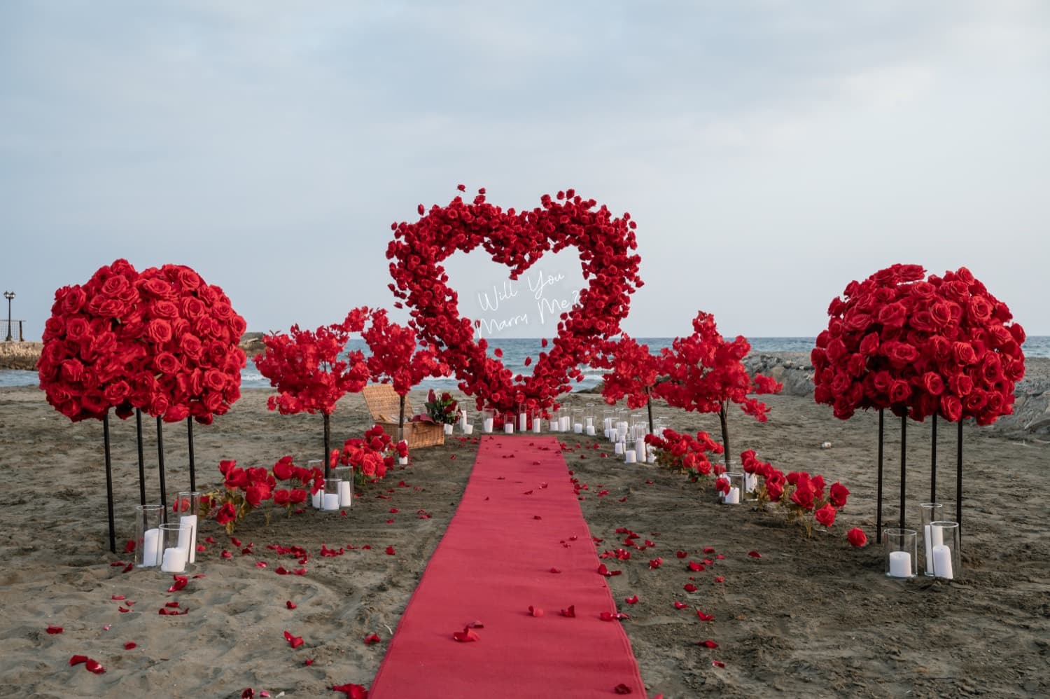 Red rose heart arch proposal on a Cyprus beach