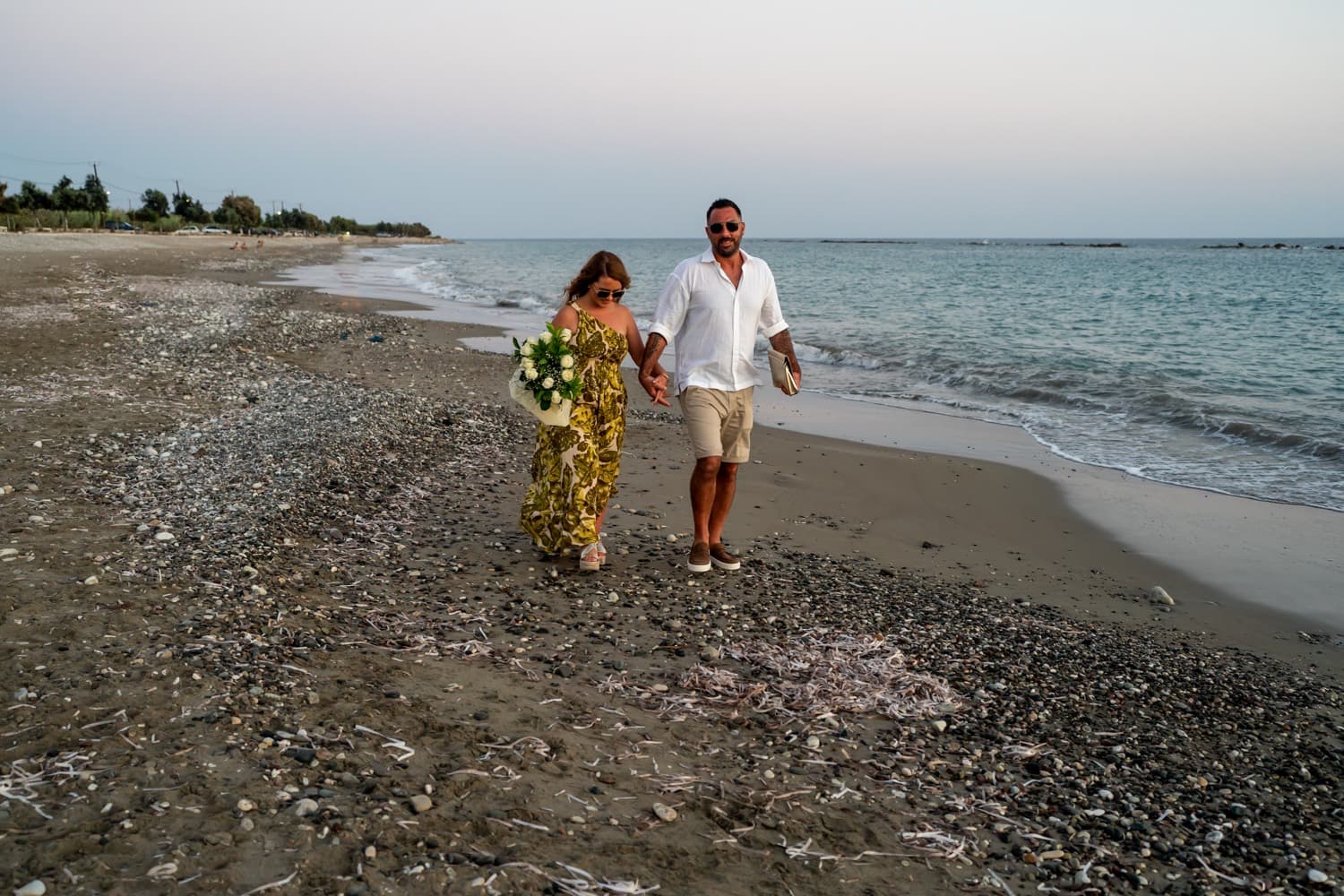 White floral aisle beach proposal in Cyprus